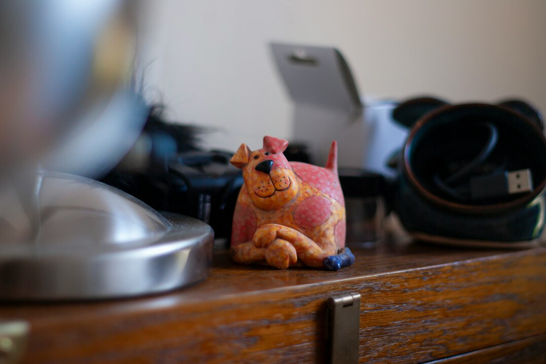Professional camera and lenses on a wooden desk