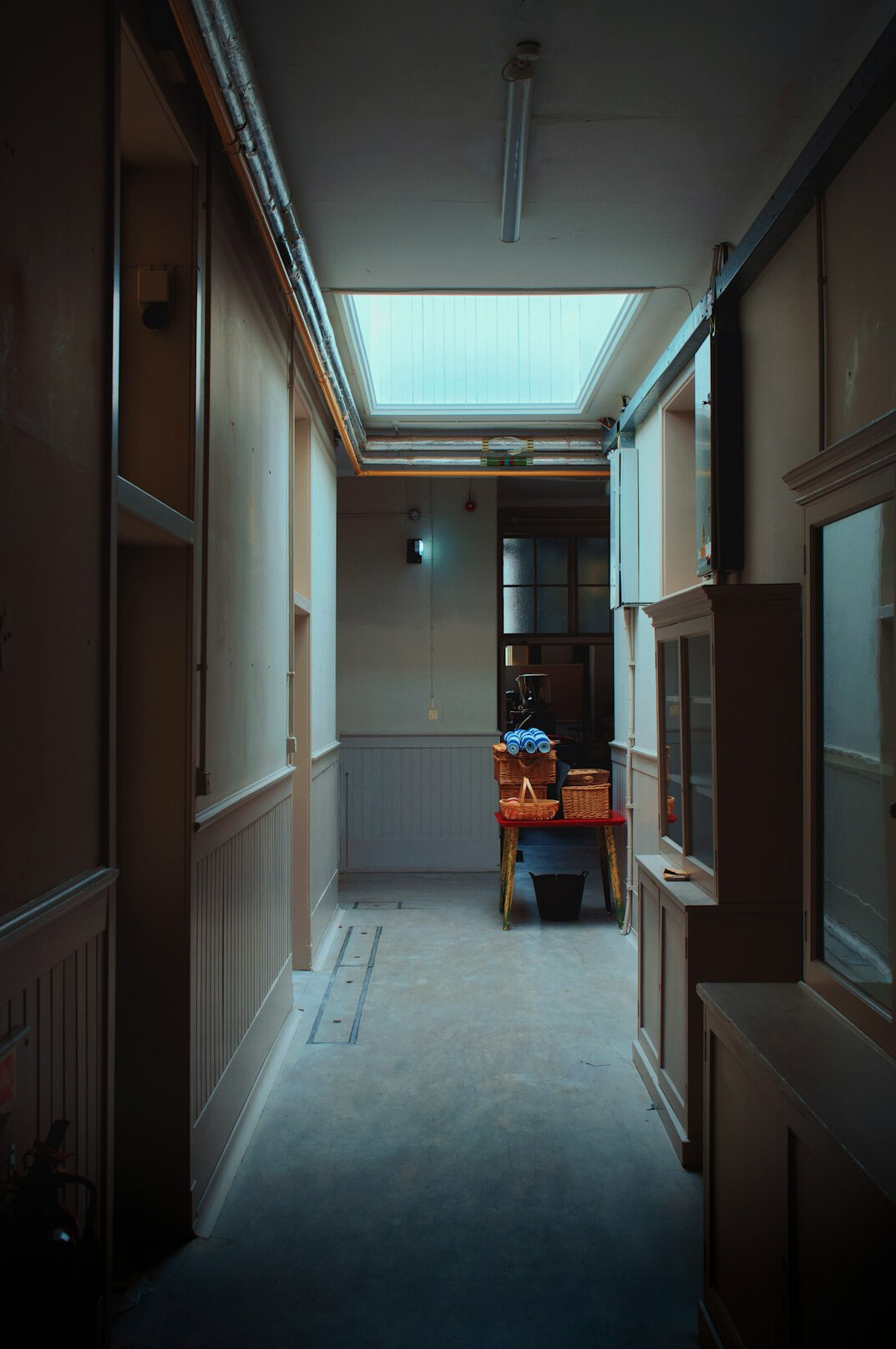 Modern editorial office interior with desks and monitors